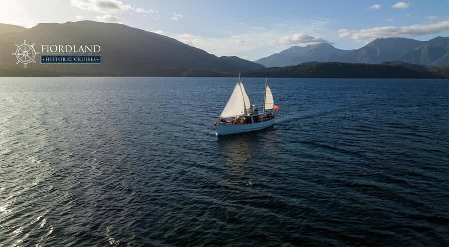 Evening Champagne Cruise on Historic 1935 Motor Yacht. - Hands-on sailing on Faith: steering and setting sails