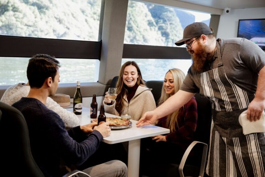 Milford Sound: Nature Cruise on a Modern Catamaran - HD Screens That Keep You in the Story