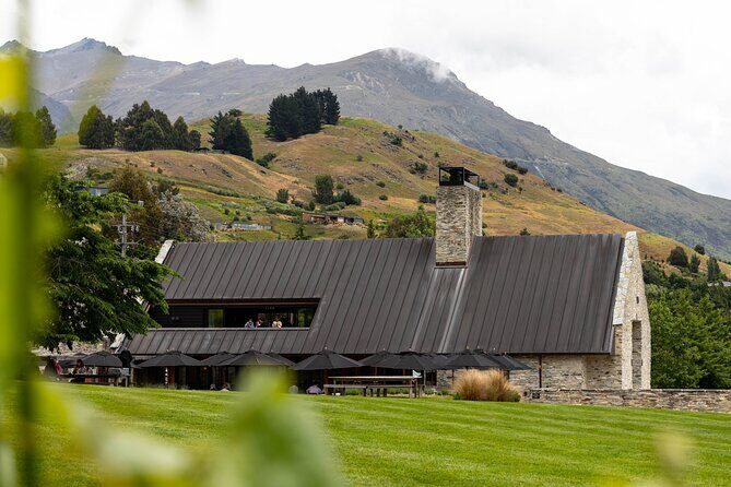 Queenstown Afternoon Wine Tour - Peregrine | Kinross | Amisfield - Amisfield Cellar Door: the stone building and the big Central Otago views